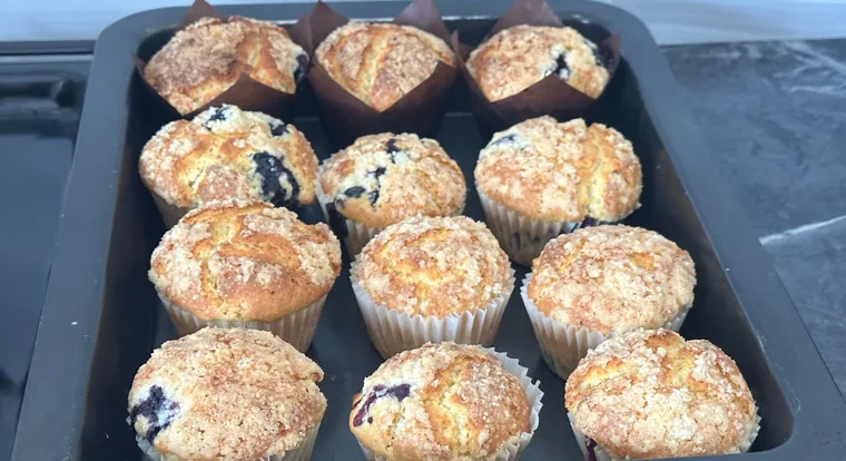 Blueberry crumble-topped muffins fresh from the oven