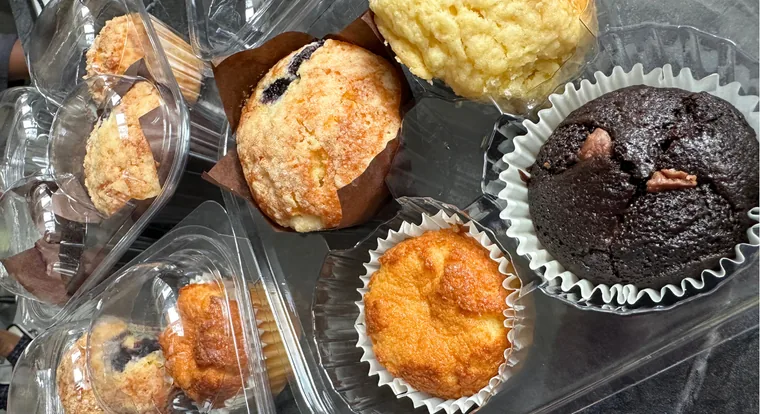 Muffins and scones boxed up, ready for collection